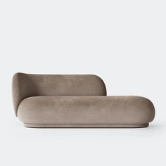 a gray couch sitting on top of a white floor