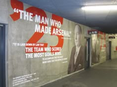 an advertisement on the side of a building for men who made arsena's