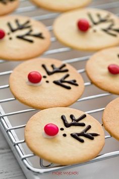 a cell phone with some cookies decorated like reindeers and noses on it's screen