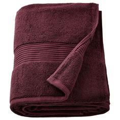 a maroon towel folded on top of a white background with the bottom rolled up to show it's edge