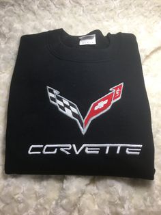 the corvette logo is shown on a black shirt