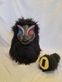 Black, Blue, and Red furred dino mask! The mask is all hand painted and sprayed with mod podge for protection! The fur is all hand and machine sewn none of it is glued! The mask can fit perfectly on a 22 inch head but could fit 21-23 inch. The tail is filled with stuffing and all hand/machine sewed If you have any questions about the mask please feel free to contact me! Handmade Black Masks And Prosthetics For Carnival, Handmade Black Carnival Masks And Prosthetics, Handmade Black Masks And Prosthetics For Costume, Handmade Full Face Black Mask, Dino Mask, Dinosaur Mask, Painting Fur, Mask Painting, Surprise Az