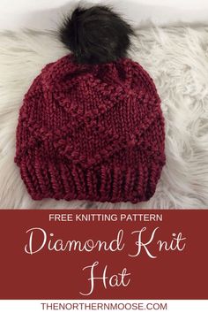 a red knitted hat with a black pom - pom on top and text overlay that reads free knitting pattern diamond knit hat