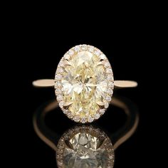 A 14k yellow gold and 3.63 ctw diamond engagement ring featuring a custom designed halo setting. DM414 3.70 grams Ring Size: 5.5 Center Diamond (1) Oval Cut Color: K - L Clarity: I1 Carat Weight: 3.43 ctw Side Diamonds Round Cut Color: G - H Clarity: SI1 - SI2 Carat Weight: 0.20 ctw Total Carat Weight: 3.63 ctw Diamond Halo Ring, Halo Setting, Amber Ring, Gold Engraving, Cabochon Ring, Halo Diamond Ring, Halo Ring, Halo Rings, Diamond Halo