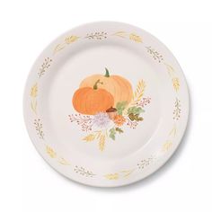 a white plate with two pumpkins painted on the side and leaves around it's rim