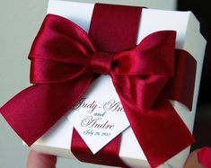 a white box with a red bow on it