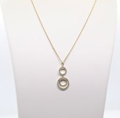 The Gold Loop Necklace is a beautiful piece of jewelry that features double round CZ pendants. It's sure to become a favorite! The necklace is available in a variety of lengths, so you can find the perfect fit. It's also available in a variety of finishes, so you can choose the one that best suits your personal style. Elegant Long Necklace With Round Pendant For Gift, Round Diamond Necklace With Chain For Gift, Diamond Necklace Gift With Chain, Round Diamond Necklace Gift With Chain, Round Long Chain Necklace For Gift, Formal Round Pendant Costume Necklace, Loop Necklace, Best Suits, Cz Pendant