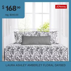 a daybed with black and white flowers on it for $ 108 00 reg $ 240 00