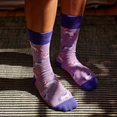 Let your inner sparkle shine with these light and dark purple socks! Put a little extra magic into your step with this pair’s whimsical pattern of leaping unicorns and tiny stars. Fairtrade, GOTS, and Vegan Certified Terry padding for comfort Machine wash cold. Do not Bleach. Tumble dry Low. Do not Iron. 80% Fairtrade Organic Cotton, 18% Recycled Polyester, 2% Elastane Made in India Fit for US Men’s Shoe Sizes: Small (4-8), Medium (8-13), Large (13+) Fit for US Women’s Shoe Sizes: Small (5-9), M Casual Purple Socks For Gifts, Casual Purple Socks As Gift, Casual Purple Socks For Gift, Unicorn Socks, Trevor Project, Purple Socks, Work Opportunities, Unicorn Pattern, Tiny Star