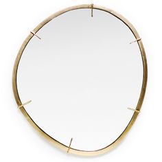 a round mirror with gold trim around it