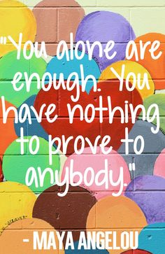 colorful balloons painted on a brick wall with a quote from maya angelou above it