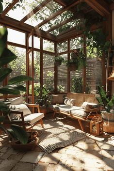 the sun shines through an open air room with lots of plants and wicker furniture