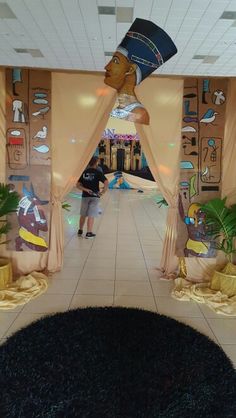 the entrance to an egyptian themed mall with statues and decorations on it's walls