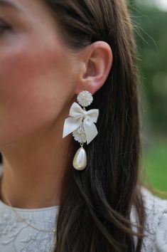 embellished mother of pearl + ivory bow – Nicola Bathie Jewelry Nicola Bathie Mclaughlin, Nicola Bathie, Bridal Pearl Earrings, Bridal Jewels, Silk Bow, Bridal Earrings Pearl, Gold Silk, Bow Earrings, White Bow