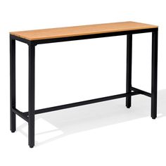 a wooden table sitting on top of a white floor next to a black metal frame