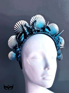 Yet another attempt at capturing the beauty of the ocean with our mermaid crown, crafted from an exquisite selection of seashells and inspired by the wonder of the sea. Handcrafted in deep ocean blues and shimmering black highlights, this seashell headband is for any sea-loving mermaid looking to add a touch of mystical magic to their look. 



Color - Deep Blue hues and black shimmer highlights


Age Group/Gender - 
Fits ages 10 and up & Adults Unisex

Material - Headband with sea shells and pa Handmade Blue Shell, Blue Bohemian Shell For Summer, Blue Ocean-inspired Shell For Summer, Bohemian Blue Shell For Summer, Material Headband, Seashell Headband, Mermaid Headpiece, Seashell Crown, Ocean Mermaid