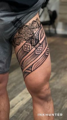 a man with a tattoo on his leg