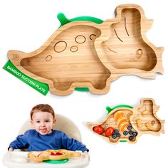 a baby sitting in a high chair next to two wooden trays with food on them