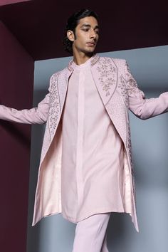 Pale pink open sherwani with heavy dori and glass bead embellishments all over. Paired with a kurta and pant.
Components: 3
Pattern: Embroidered
Type Of Work: Dori, Glass Bead
Neckline: Band collar
Sleeve Type: Long
Fabric: Japanese Suiting
Color: Pink
Other Details: 
Approx. product weight: 1.5 kgs
Occasion: Wedding - Aza Fashions Open Sherwani, Japanese Suit, Pink Sherwani, Kurta And Pants, Indian Wedding Wear, Wear Store, Beaded Neckline, Kurta With Pants, Band Collar