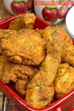 fried chicken in a red container on a table