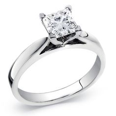 a white gold ring with a princess cut diamond