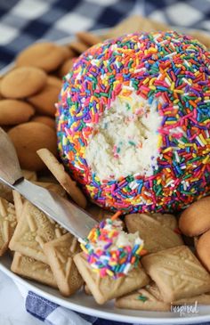 a plate with cookies and sprinkles on it