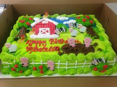 a birthday cake in the shape of a farm scene