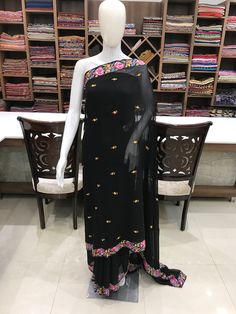 A Marvellous Embroidered Kashmiri Saree which you can wear at any party or a wedding. - - - - - - - - - - - - - - - - - - - -  Product Details - Condition: Brand New (made to order) - Style: Sari Dress - Embroidery: Papier Mache Hand Embroidery - Base Colour: Black - Embroidery Colour: Multi-Colour - Care Instructions: Dry Clean Only F A B R I C Saree: Viscose Georgette Blouse: Indian Crepe F I N I S H - Unstitched You can get it stitched locally. - Stitched Want your blouse ready to wear, let us know the style you want and we will stitch it for you. PLEASE NOTE: We would require you to share certain precise body measurements to stitch the blouse.  If you require guidance on how to take your measurements, please drop us a message. - Blouses are not made to US/UK/EU sizing charts, they are Semi-stitched Embroidered Georgette Dress, Black Georgette Lehenga With Floral Embroidery, Georgette Sharara With Embroidered Border, Festive Embroidered Border Fabric, Black Bollywood Embroidered Fabric With Border, Bollywood Style Black Embroidered Fabric, Festive Dress With Embroidered Border And Traditional Drape, Bollywood Black Embroidered Fabric, Embroidered Fabric With Border For Diwali Party