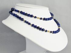 Rich, bold, beautiful colors in a classic and elegant style! These blue lapis lazuli beads have gold pyrite flecks and are accented with 14 karat gold filled polished beads. Lapis has been a prized semi-precious stone for centuries due to its intense color. The necklace is made ready to ship in two lengths -- 20 inch and 16 inch (51 cm and 41 cm). Please send a custom order request if you need a different length. This necklace and all KBeadsIt jewelry ships free with USPS first class domestic sh Elegant Lapis Lazuli Necklace With Faceted Beads, Gold Lapis Lazuli Necklace With Faceted Beads, Royal Blue Lapis Lazuli Necklace With Round Beads, Blue Faceted Lapis Lazuli Beaded Necklaces, Turquoise Gemstone Earrings, Sapphire-colored Lapis Lazuli Round Beaded Jewelry, Freshwater Pearl Jewelry, Lapis Lazuli Beads, Natural Stone Jewelry