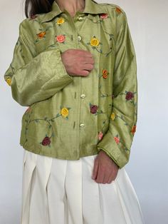 Excellent condition with no noted flaws. 100% silk jacket fully lined with embroidered details. Seen here worn oversized on a women's modern size small.  measurements are taken flat 22" pit to pit 23" long 100% silk  fully lined gre Casual Long Sleeve Silk Outerwear, Spring Embroidered Green Outerwear, Green Silk Long Sleeve Outerwear, Green Silk Outerwear For Spring, Vintage Long Sleeve Outerwear With Floral Embroidery, Vintage Embroidered Green Outerwear, Vintage Green Embroidered Outerwear, Embroidered Long Sleeve Silk Outerwear, Vintage Silk Outerwear For Spring