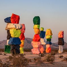 colorful rocks stacked on top of each other in the desert