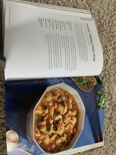 the book is open to show an image of pasta