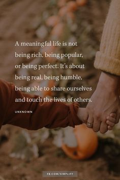 two people holding hands with the words, a meaning life is not being rich, being popular or being perfect it's about being real, being humble