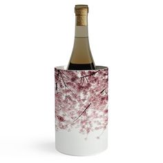 a bottle of wine in a white cup