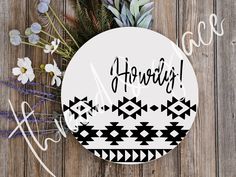 a round sticker with the words happily on it next to some flowers and plants