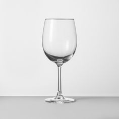 a wine glass sitting on top of a table