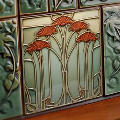 decorative tiles with red flowers on them