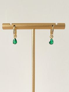 Hey lovely Etsy shopper!  Do you love these beautiful Dainty Gold & Emerald Glass Huggie Earrings? Highest quality 14ct Gold Plated 925 Sterling Silver. Removable Emerald Charm. Simple and elegant minimalist design. They make the perfect everyday earring or the most thoughtful May Birthstone gift!  Happy Shopping! And a big thank you for looking at our beautiful jewellery, if you love our stuff follow us on Instagram @shellseekersjewellery. Teardrop Hoop Earrings For May Birthstone, Everyday Teardrop Earrings For May Birthstone, Dainty Gold Earrings With Emerald, Teardrop Earrings For Everyday - May Birthstone, Dainty Gold Emerald Earrings, Gold Emerald Huggie Earrings, Green Emerald Huggie Earrings, Elegant Pear-shaped Emerald Earrings, Sea Earrings