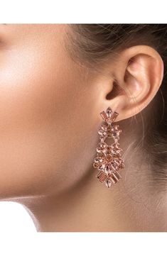 Show off glamorous sparkle in mixed-cut crystal drop earrings finished in gleaming goldtone plate. 2 1/2" drop; 3/4" width Post back Goldtone plate/glass Imported Rose Gold Crystal Chandelier Earrings For Party, Rose Gold Crystal Earrings With Sparkling Stones For Party, Glamorous Crystal Earrings With Plating, Glamorous Rose Gold Crystal Earrings For Formal Occasions, Glamorous Rose Gold Chandelier Earrings, Glamorous Rose Gold Crystal Earrings For Evening, Crystal Drop Earrings, Crystal Drop, Crystal Cluster