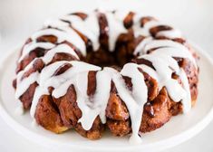 a bundt cake with icing on a white plate