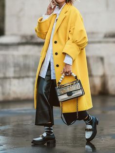 Trendy Oversized Yellow Outerwear, Chic Yellow Single Breasted Outerwear, Chic Yellow Single-breasted Outerwear, Elegant Yellow Outerwear With Pockets, Yellow Long Coat For Winter, Yellow Long Coat For Fall, Chic Yellow Oversized Outerwear, Oversized Yellow Outerwear For Spring, Chic Oversized Yellow Outerwear