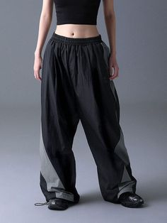 These casual and comfortable wide banding pants feature color-blocking panels design and drawcord at hem that allow to adjust silhouette. It's made from lightweight nylon and has breathable mesh lining in half-length. - Elasticated waistband with inside drawstring  - Two front slash pockets- One back patch pocket- Color-blocking panel and piping- 3M lettering logo print- Adjustable drawcord at hem- Logo-engraved stopper and tip- Half mesh lining- Wide fit - Unisex wear Panels Design, Lettering Logo, Back Patch, Panel Design, Pants Black, Logo Print, Piping, Patch Pocket, Black Pants