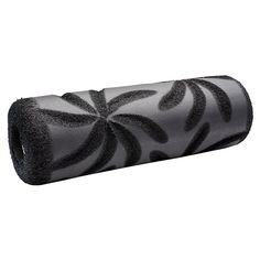 a black and white photo of a rolled up towel