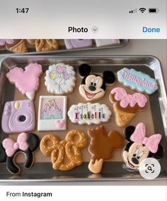 mickey and minnie mouse cookies on a tray