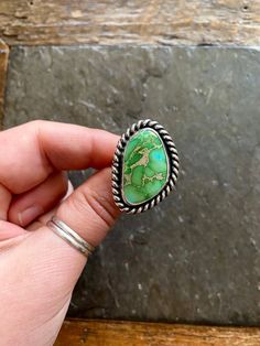 Handmade Sonoran Turquoise and sterling silver ring.  Will fit Size 8 US. American Southwest vintage style design. Beautiful striking grassy green colored Sonoran turquoise with hints of blue, and sandy colored matrix. Chunky rope like trim. Hand polished Rustic looking patina.  Chunky split style shank/band. Hand stamped Indian style arrow and rising sun hallmark on backside.  100% Sterling silver. --------------------- Every piece will come packaged in a recycled kraft paper jewelry box. We sh Southwestern Green Turquoise Ring With Large Stone, Southwestern Style Green Turquoise Ring With Large Stone, Southwestern Style Green Turquoise Ring As Gift, Southwestern Green Ring With Large Stone, Handmade Southwestern Green Rings, Bohemian Green Untreated Turquoise Ring, Bohemian Untreated Green Turquoise Ring, Untreated Green Turquoise Bohemian Ring, Southwestern Style Collectible Turquoise Ring