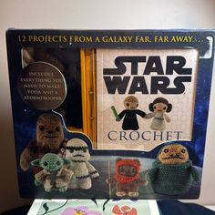 the star wars crochet book and toy set is displayed in front of a box