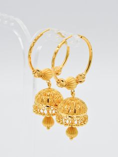 This 22ct Gold Ball Jhumki Bali weighs 17.64 grams and is crafted with precision and quality. Featuring a shiny and elegant design, these earrings are the perfect addition to any outfit, adding a touch of sophistication and luxury. Purity: 22ct gold Width: 2.6 cm (Diameter) 2 Grams Gold Earrings, Gold Bali Design, 2 Grams Gold Earrings Designs, Gold Bali, Girls Kurti, Bali Design, Bangle Box, Navratri Chaniya Choli, Gold Earrings Models