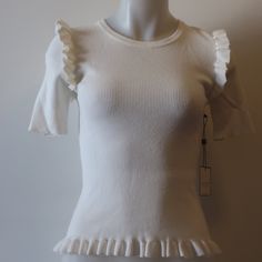 Nwt Womens Laundry By Shelli Segal Cream Ribbed Ruffle Short Sleeve Sweater S/P Material: 80% Viscose 20% Nylon Measurements (Flat): Armpits: 13" Length: 21" Shoulder: 13" New With Tags....232_ran_kat-1 Fitted Cotton Knit Top With Ruffles, White Ruffled Knit Top For Spring, Fitted Crew Neck Knit Top With Ruffles, Fitted Ruffle Crew Neck Knit Top, Fitted Ruffle Knit Top With Crew Neck, Fitted Knit Top With Ruffles And Short Sleeves, Fitted Ruffle Knit Top With Short Sleeves, Fitted Cream Tops With Ruffles, Gold Cardigan