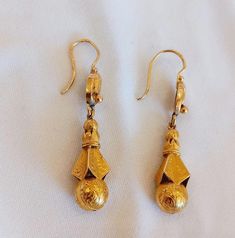 Discover the exquisite charm of these Antique Dangling 22K Gold Earrings, showcasing an elegant and classic design. Handcrafted with precision in 22K yellow gold, these earrings exude a regal and luxurious character that elevates any look. Every detail on these earrings is meticulously crafted, providing them with an impressive presence at any event. They complement any outfit, making them perfect for both everyday wear and special occasions. The timeless design ensures they remain a standout piece in any jewelry collection. Weighing 4.9 grams, these earrings offer a comfortable yet striking accessory. Their handcrafted nature adds a touch of uniqueness and quality that is perfect for gifting or personal use. If you have any questions, please feel free to contact us. Thank you for visiting 22k Gold Earrings, Earrings Dangling, Gold Dangle Earrings, Outfit Making, Gold Earrings Dangle, Jewelry Vintage, 22k Gold, Earrings Handmade, Antique Gold