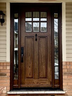 the front door of a house with two sidelights